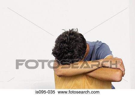 Stock Photography - Teenage boy sulking. Fotosearch