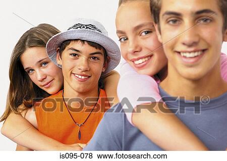 Teenage boys and girls playing piggyback View Large Photo Image Stock Photo - Teenage boys and girls playing piggyback. Fotosearch