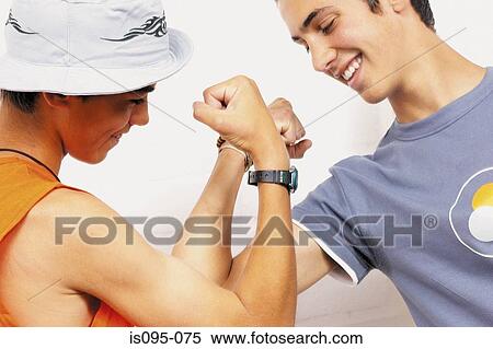 Teenage boys flexing muscle View Large Photo Image Stock Photography - Teenage boys flexing muscle. Fotosearch