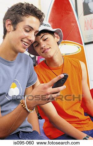 Teenage boys with mobile View Large Photo Image Stock Image - Teenage boys with mobile. Fotosearch