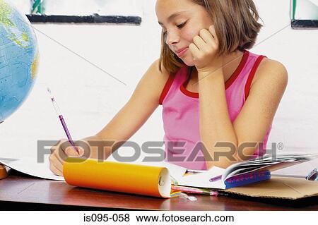 Stock Photo - Teenage girl doing homework. Fotosearch