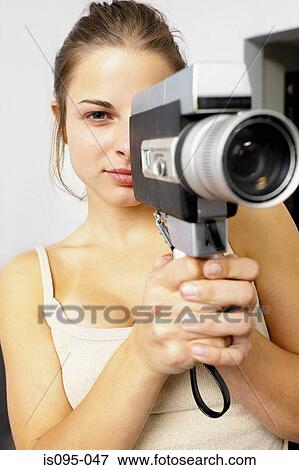 Stock Photo - Teenage girl filming. Fotosearch