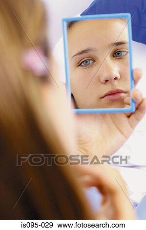 Teenage girl looking in mirror View Large Photo Image Stock Photo - Teenage girl looking in mirror. Fotosearch