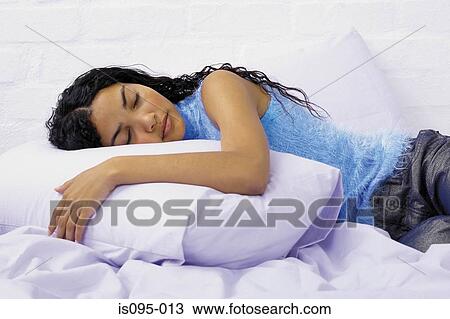 Stock Image - Teenage girl sleeping. Fotosearch