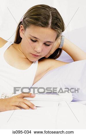 Teenage girl with telephone View Large Photo Image Picture - Teenage girl with telephone. Fotosearch