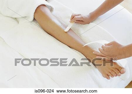 Woman being waxed View Large Photo Image Picture - Woman being waxed. Fotosearch