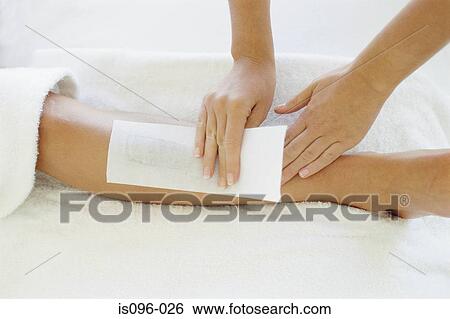 Stock Photograph - Woman being waxed. Fotosearch