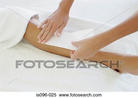 Woman being waxed View Large Photo Image Stock Photography - Woman being waxed. Fotosearch