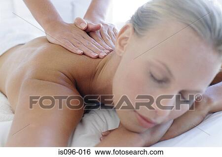 Stock Photograph - Woman receiving back massage. Fotosearch