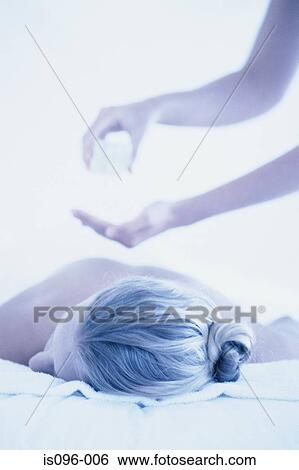 Stock Photograph - Woman receiving back treatment. Fotosearch