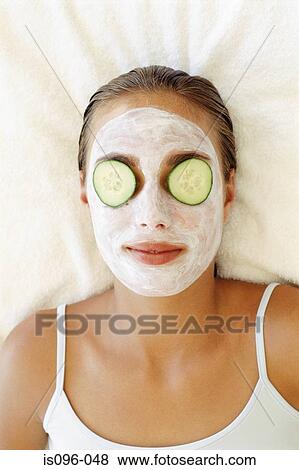 Woman receiving face mask View Large Photo Image Stock Photo - Woman receiving face mask. Fotosearch