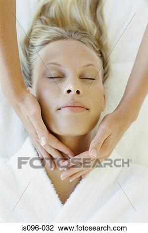 Woman receiving facial massage View Large Photo Image Stock Image - Woman receiving facial massage. Fotosearch