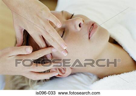 Woman receiving facial massage View Large Photo Image Stock Image - Woman receiving facial massage. Fotosearch