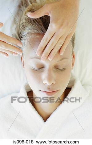 Woman receiving facial massage View Large Photo Image Stock Photo - Woman receiving facial massage. Fotosearch