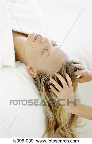 Woman receiving head massage View Large Photo Image Stock Photo - Woman receiving head massage. Fotosearch