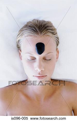 Woman receiving hot rock treatment View Large Photo Image Stock Photography - Woman receiving hot rock treatment. Fotosearch