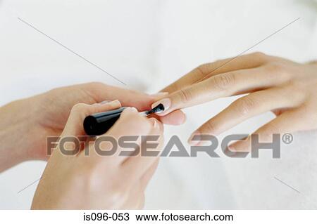 Woman receiving manicure treatment View Large Photo Image Stock Image - Woman receiving manicure treatment. Fotosearch