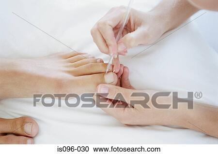Woman receiving podiatry treatment View Large Photo Image Stock Image - Woman receiving podiatry treatment. Fotosearch