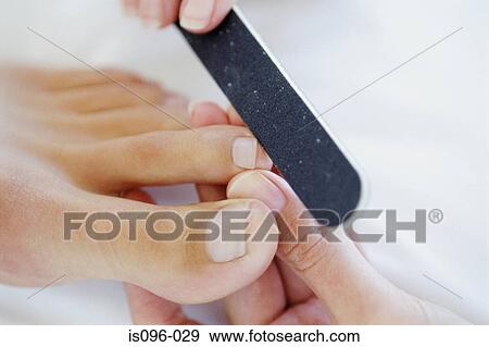 Woman receiving podiatry treatment View Large Photo Image Stock Photo - Woman receiving podiatry treatment. Fotosearch