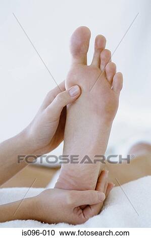 Woman receiving reflexology treatment View Large Photo Image Stock Image - Woman receiving reflexology treatment. Fotosearch