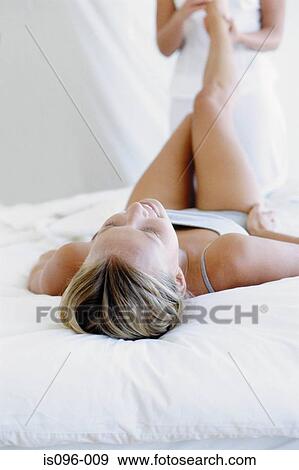 Woman receiving reflexology treatment View Large Photo Image Stock Photo - Woman receiving reflexology treatment. Fotosearch
