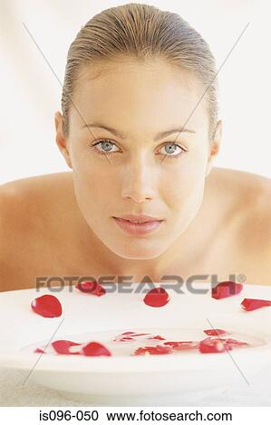 Stock Image - Woman rinsing face. Fotosearch