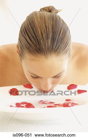 Woman rinsing face View Large Photo Image Stock Image - Woman rinsing face. Fotosearch