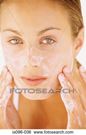 Stock Photograph - Woman washing face. Fotosearch