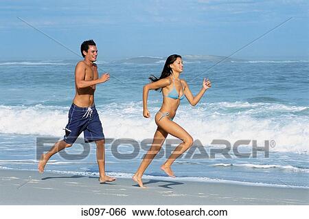 Stock Images Of Woman And Man Jogging On The Beach Is097 066 Stock Image Woman And Man Jogging On The Beach Fotosearch Search Photography