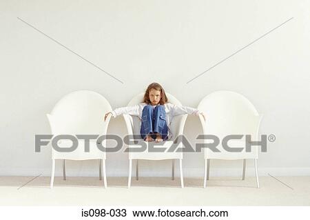 Stock Image - Girl on a chair. Fotosearch