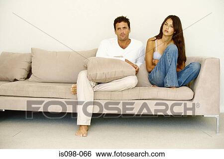 Man and woman on sofa View Large Photo Image Stock Photograph - Man and woman on sofa. Fotosearch