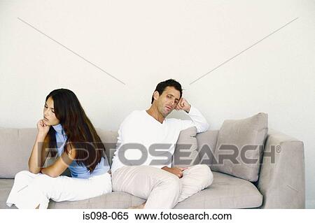 Man and woman on sofa View Large Photo Image Stock Photography - Man and woman on sofa. Fotosearch