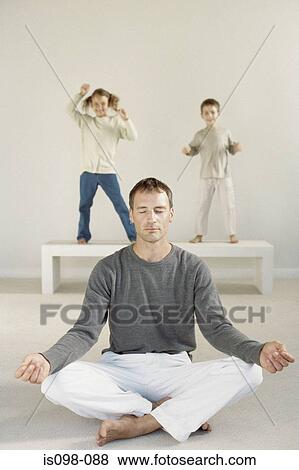 Stock Photo - Man meditating. Fotosearch