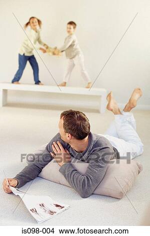 Picture - Man reading newspaper. Fotosearch