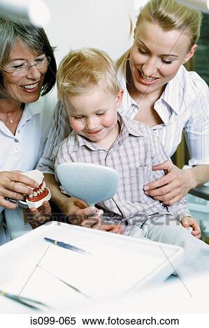 Boy being examined by dentist View Large Photo Image Stock Photography - Boy being examined by dentist. Fotosearch