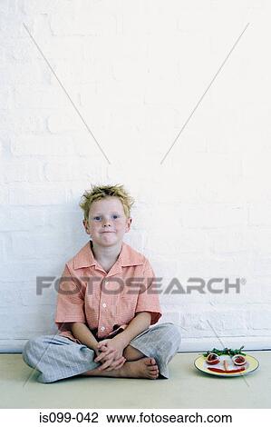 Stock Image - Boy with his meal. Fotosearch