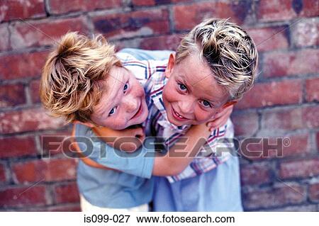 Boys fighting against wall View Large Photo Image Stock Photo - Boys fighting against wall. Fotosearch