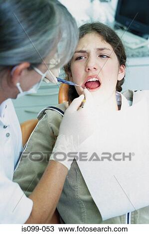 Girl being examined by dentist View Large Photo Image Stock Image - Girl being examined by dentist. Fotosearch