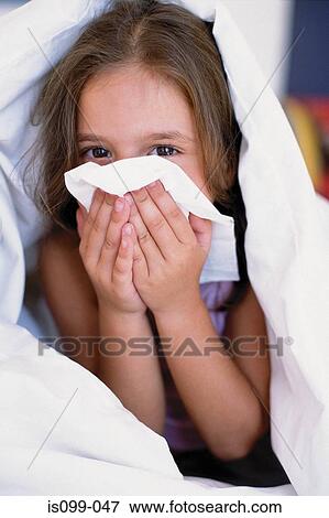 Girl blowing nose View Large Photo Image Stock Photo - Girl blowing nose. Fotosearch