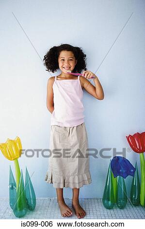Girl brushing teeth View Large Photo Image Stock Photograph - Girl brushing teeth. Fotosearch