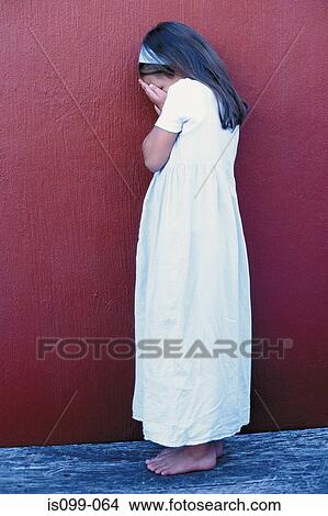 Girl crying against wall View Large Photo Image Picture - Girl crying against wall. Fotosearch