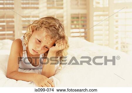 Girl sulking on bed View Large Photo Image Picture - Girl sulking on bed. Fotosearch