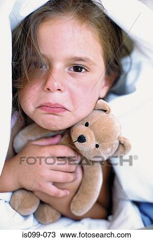 Stock Image - Girl with teddy bear. Fotosearch