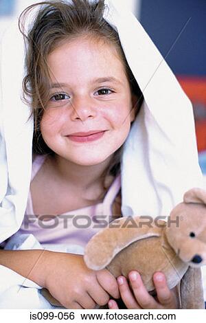 Stock Photograph - Girl with teddy bear. Fotosearch