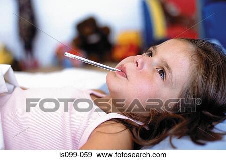 Girl with thermometer in mouth View Large Photo Image Stock Photo - Girl with thermometer in mouth. Fotosearch