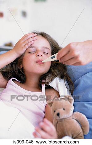 Girl with thermometer in mouth View Large Photo Image Stock Photograph - Girl with thermometer in mouth. Fotosearch