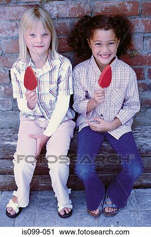 Girls eating ice cream View Large Photo Image Stock Image - Girls eating ice cream. Fotosearch