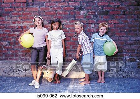 Stock Image - Portrait of boys and girls with their toys. Fotosearch