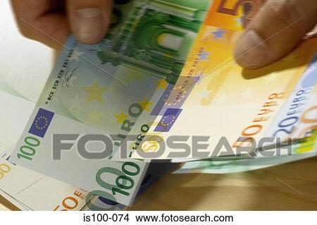 Picture - Counting money. Fotosearch