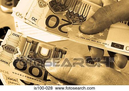 Stock Photo - Counting money. Fotosearch